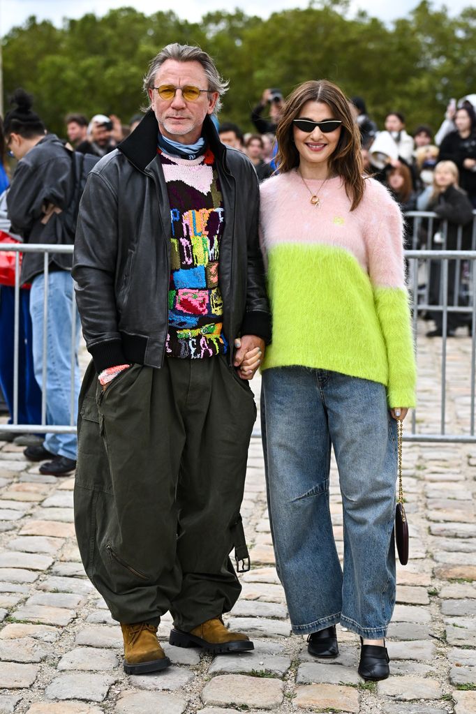 Daniel Craig and Rachel Weisz in wide leg pants and jumpers