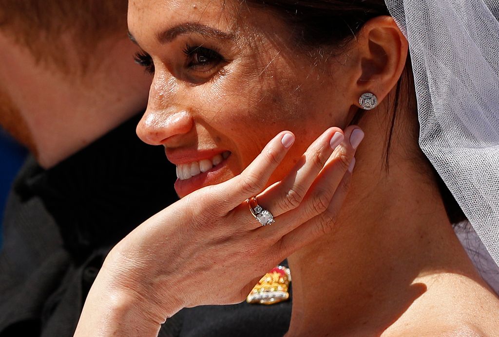 Meghan Markle showing off her wedding and engagement rings on her 2018 wedding day