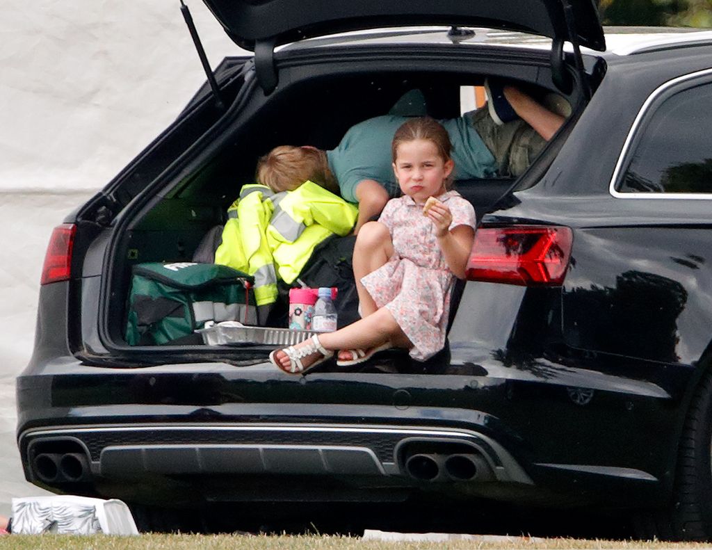 Princess Charlotte eating sausage roll in boot of car