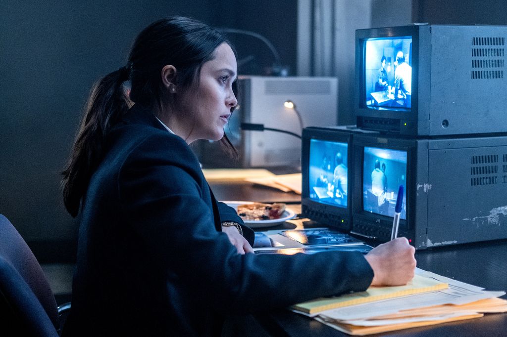 Rebecca Breeds watching a police interview on monitors