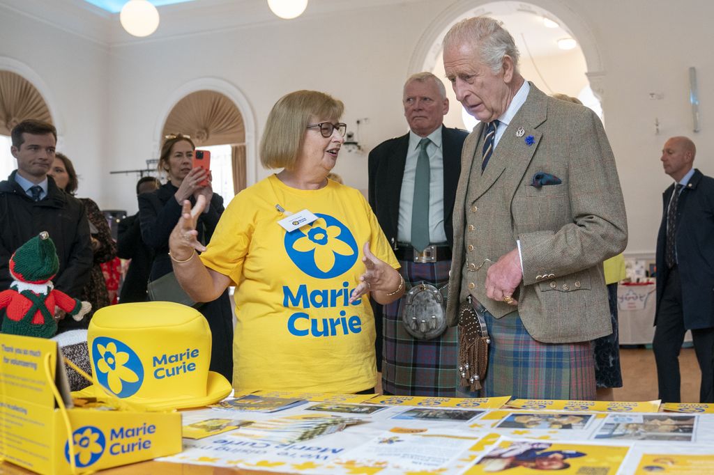 King Charles meets volunteer Susan Campbell from the Marie Curie charity 