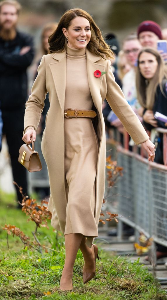 Catherine, Princess of Wales on grass in tan dress and coat