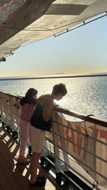 Children look out to sea on the deck of P&O cruise ship Azura