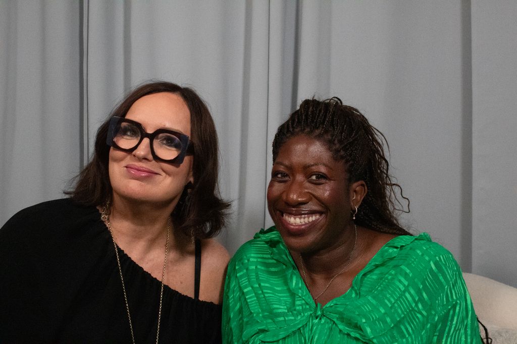 Deborah Frances-White and Ateh Jewel posing in a studio 