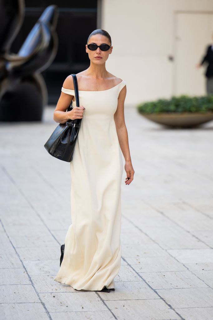 Sophia Roe wears beige dress, black pants outside Toteme during New York Fashion Week on September 10, 2024 in New York City