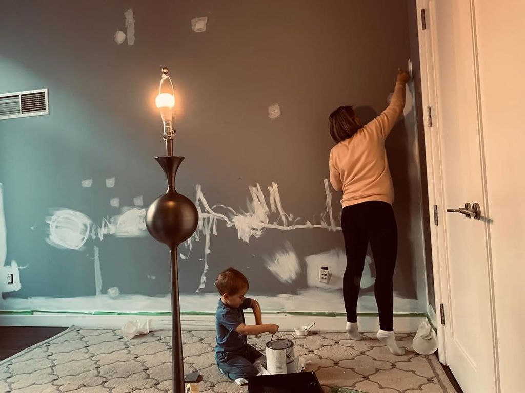 Dylan Dreyer and her son Calvin photographed painting a room inside their New York City condo, shared on Instagram