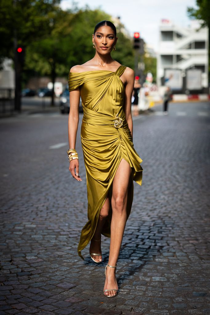 Pritika Swarup wears a gold Zuhair Murad long dress with gold detail and gold sandals, outside Zuhair Murad, during the Haute Couture Fall/Winter 2023/2024 as part of  Paris Fashion Week on July 05, 2023 in Paris, France. (Photo b