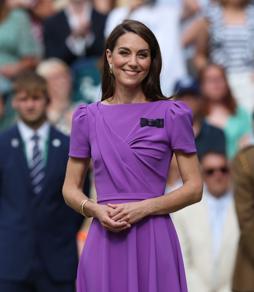 Princess Kate smiling and wearing a purple dress on Centre Court