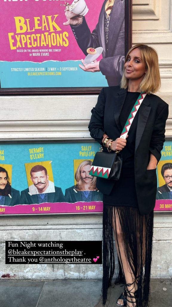 Louise Redknapp posing outside of a theatre