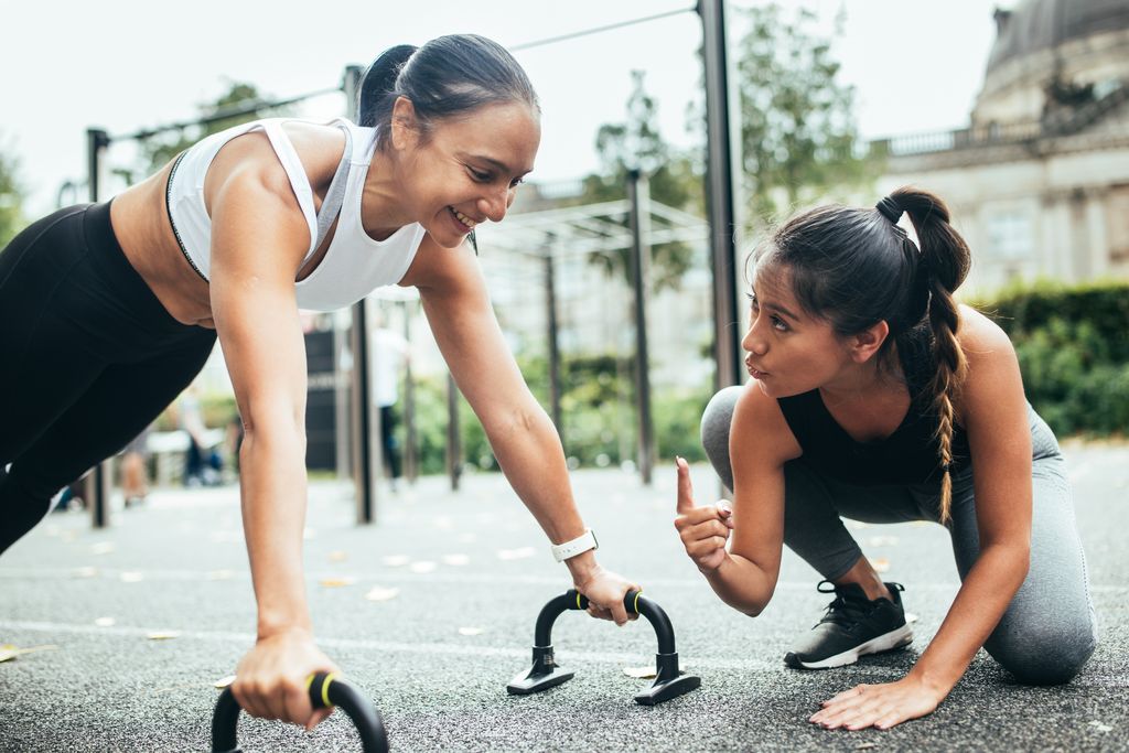 Female coach giving instruction to a woman.