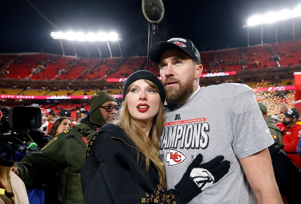 Taylor Swift celebrates with Travis Kelce #87 of the Kansas City Chiefs after defeating the Buffalo Bills