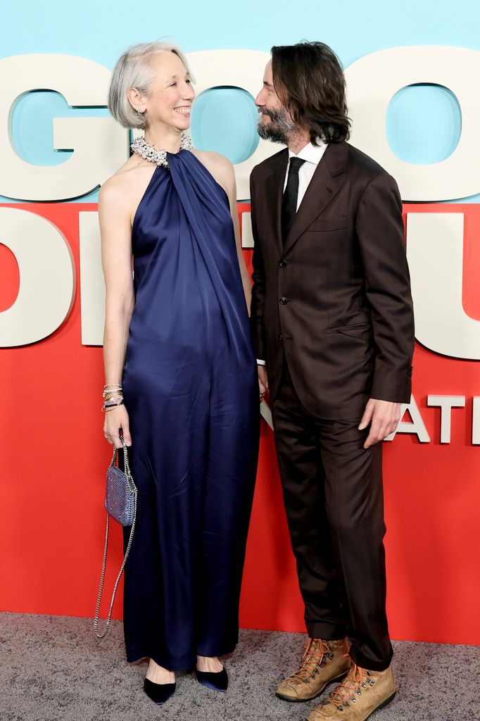 photo of keanu reeves looking at girlfriend alexandra grant on red carpet