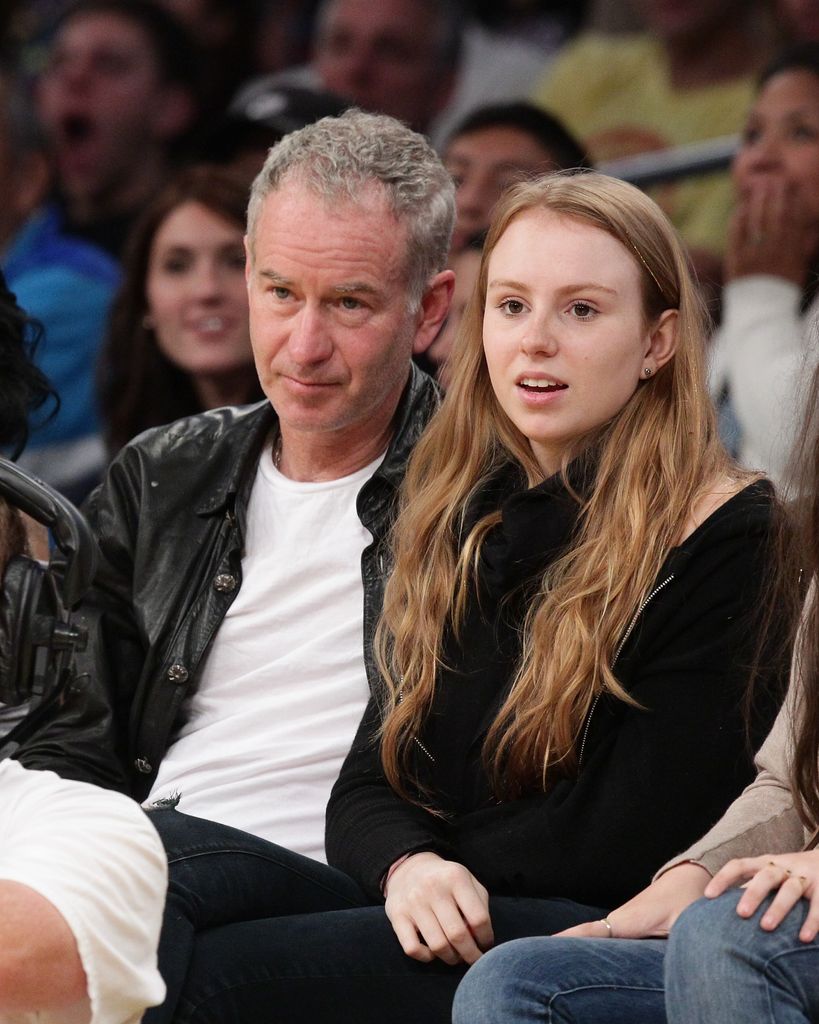 John McEnroe and his daughter Anna McEnroe at a basketball game