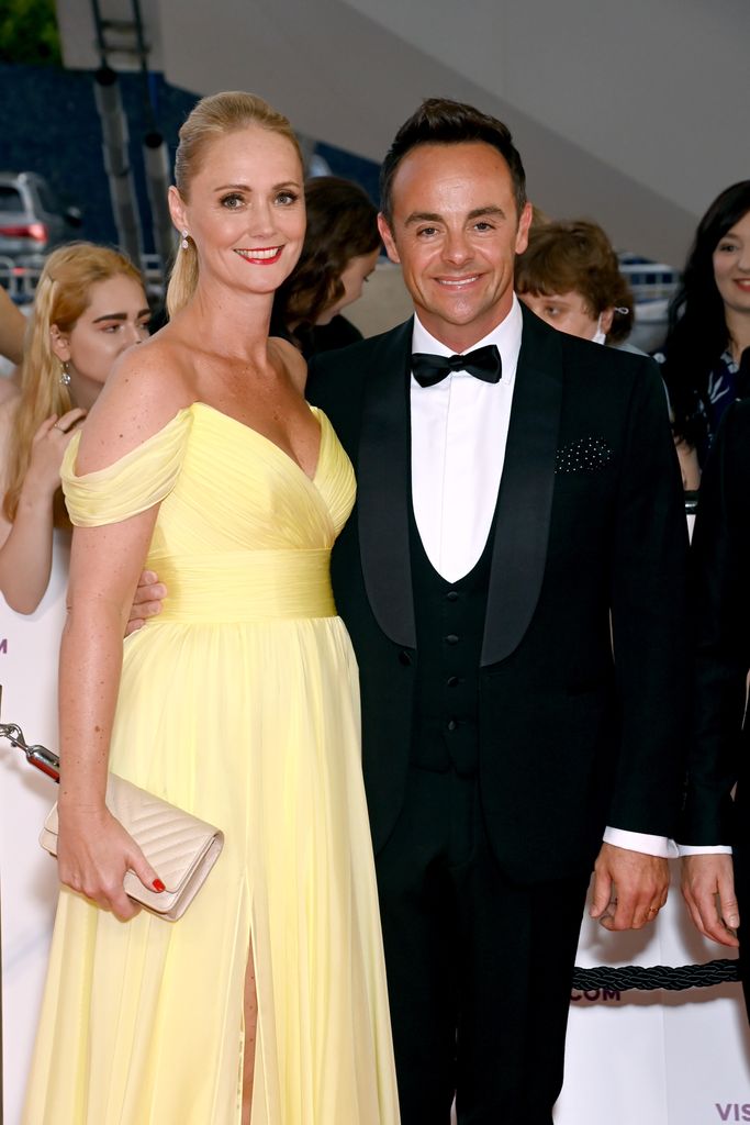 Ant McPartlin in black tie and Anne-Marie Corbett in yellow dress