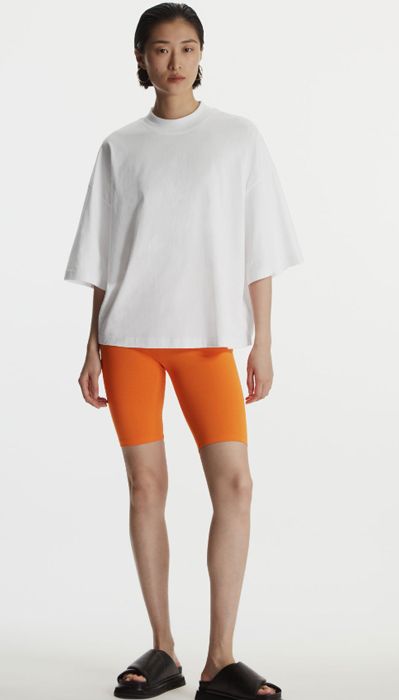 cos orange cycling shorts