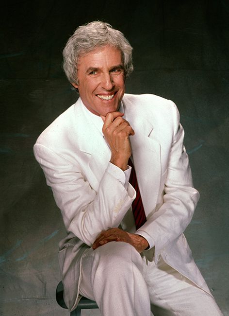 Burt Bacharach poses for portrait in white suit