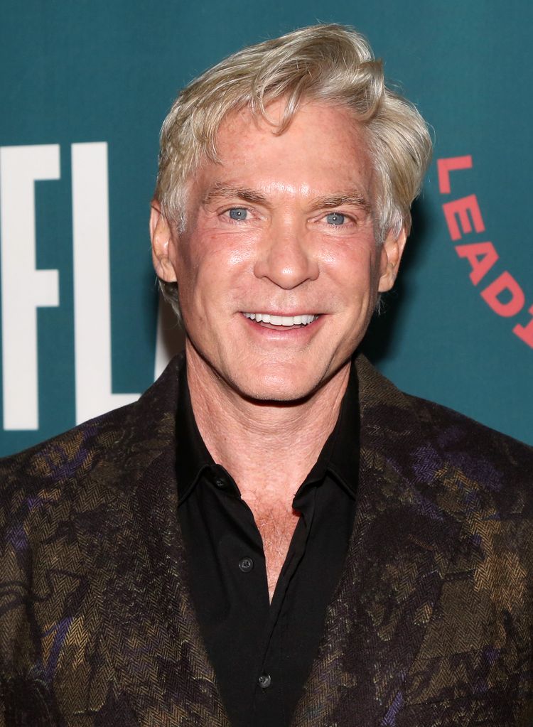 Sam Champion smiling on a red carpet