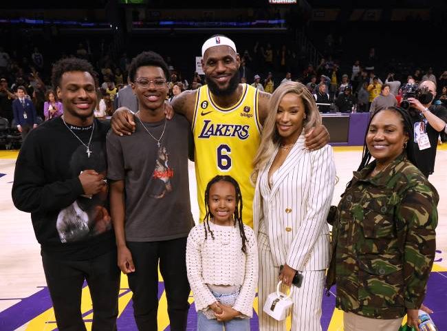 LeBron James with his wife Savannah, his three kids, and his mom celebrating his score record