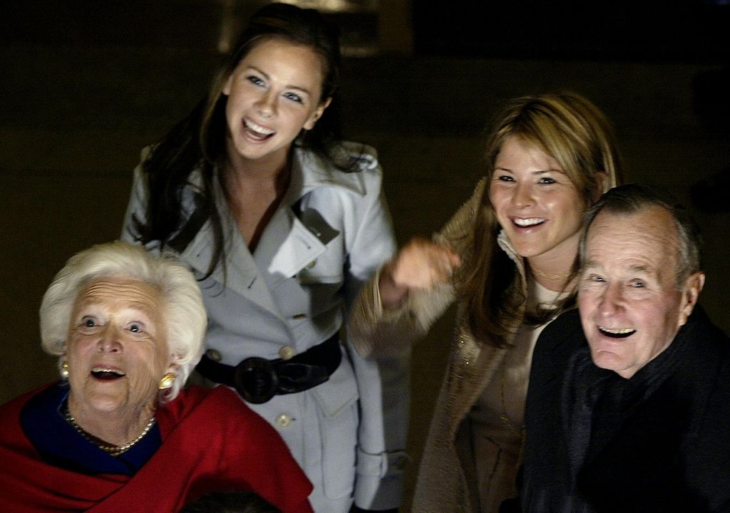 Former US President George H.W. Bush (L) with wife, former First Lady Barbara Bush, and grand-daughters Barbara (L) and Jenna, wave as they walk through the Rotunda on Capitol Hill 20 January, 2005. With a pledge to battle terrorism and promote democracy around the world, US President George W. Bush was to launch his new term today under an unprecedented security blanket and a dusting of snow. Bush, 58, was to be sworn in outside the US Capitol at noon (1700 GMT), in the 55th US presidential swearing-in and the first since the September 11, 2001 terrorist attacks that transformed his time in office. 