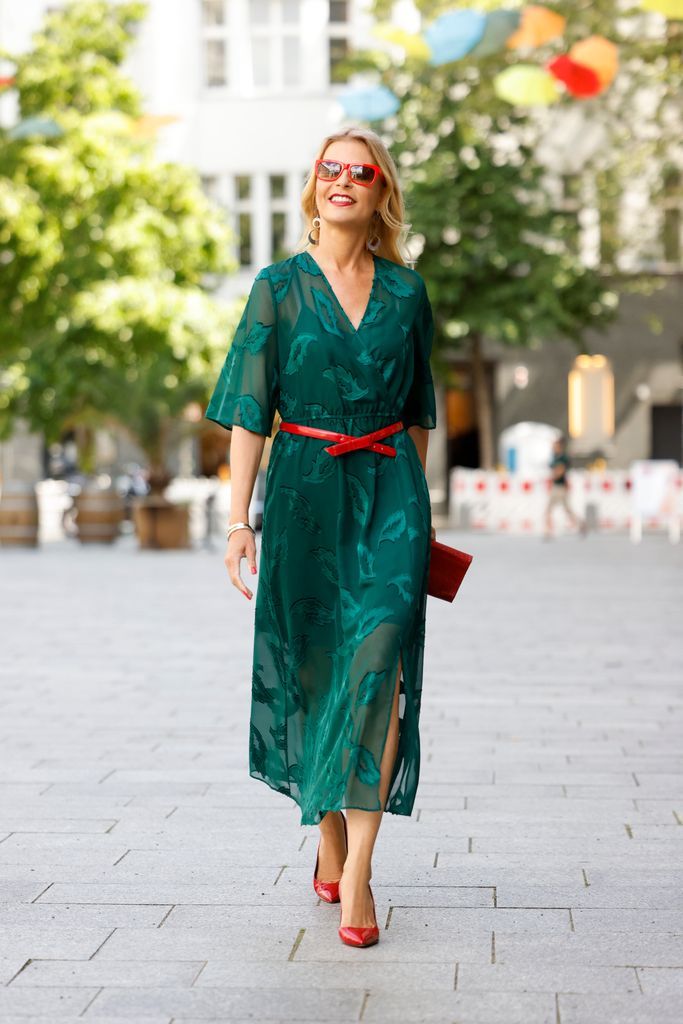 woman in green dress on street