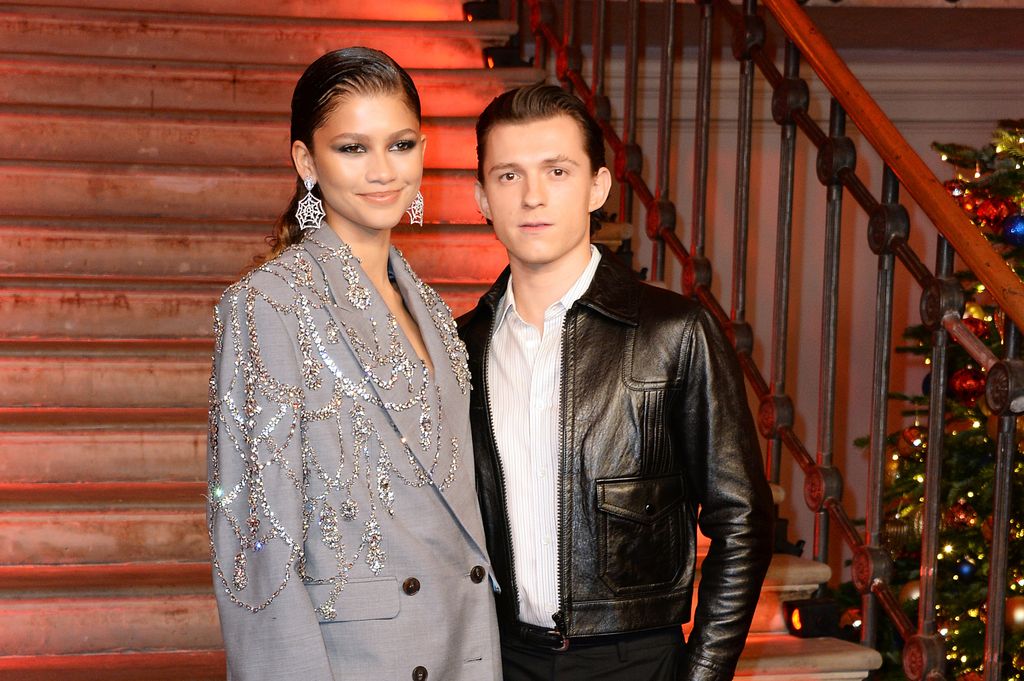 Zendaya and Tom Holland pose at a photocall for "Spider-Man: No Way Home" at The Old Sessions House on December 5, 2021 in London, England.