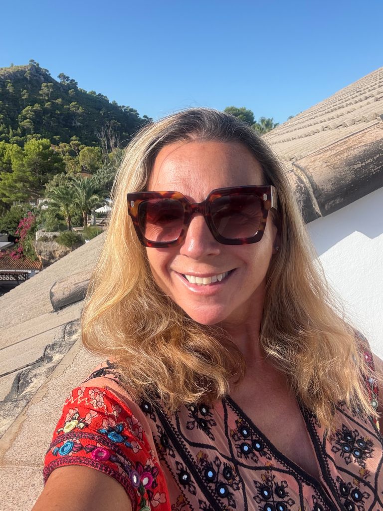 Woman taking a selfie in a printed top
