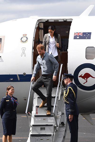 prince harry and meghan leaving plane