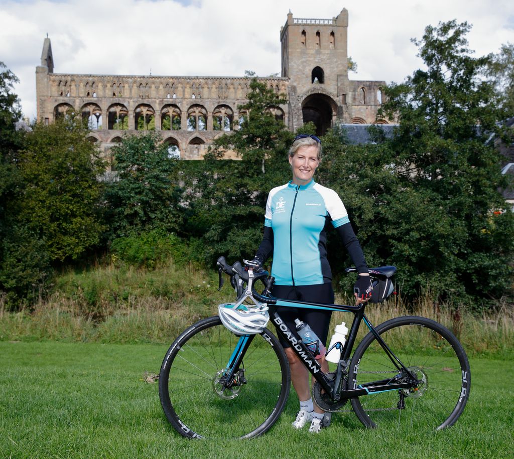 Sophie, Countess of Wessex poses for a photograph outside Jedburgh Abbey in cycling gear