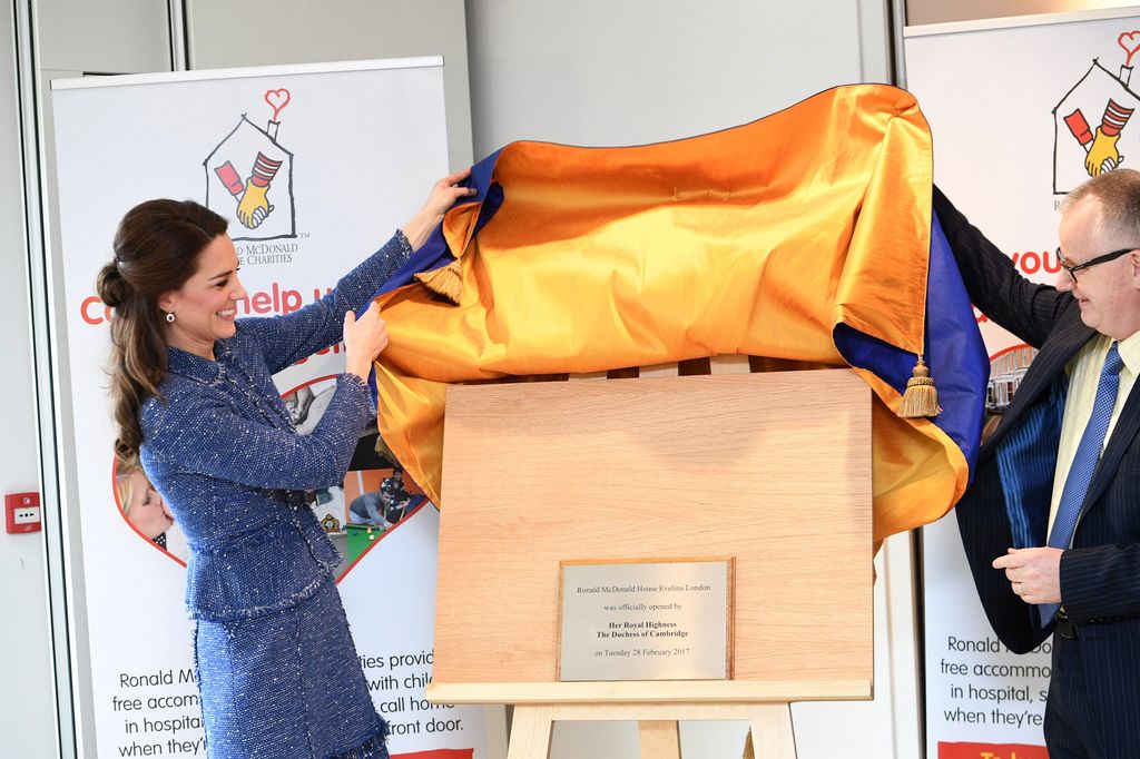 Kate unveils a plaque to commemorate her visit to the Ronald McDonald House Evelina in Lambeth to open the 'home away from home' accommodation for the families of children being treated at Evelina London Children's Hospital