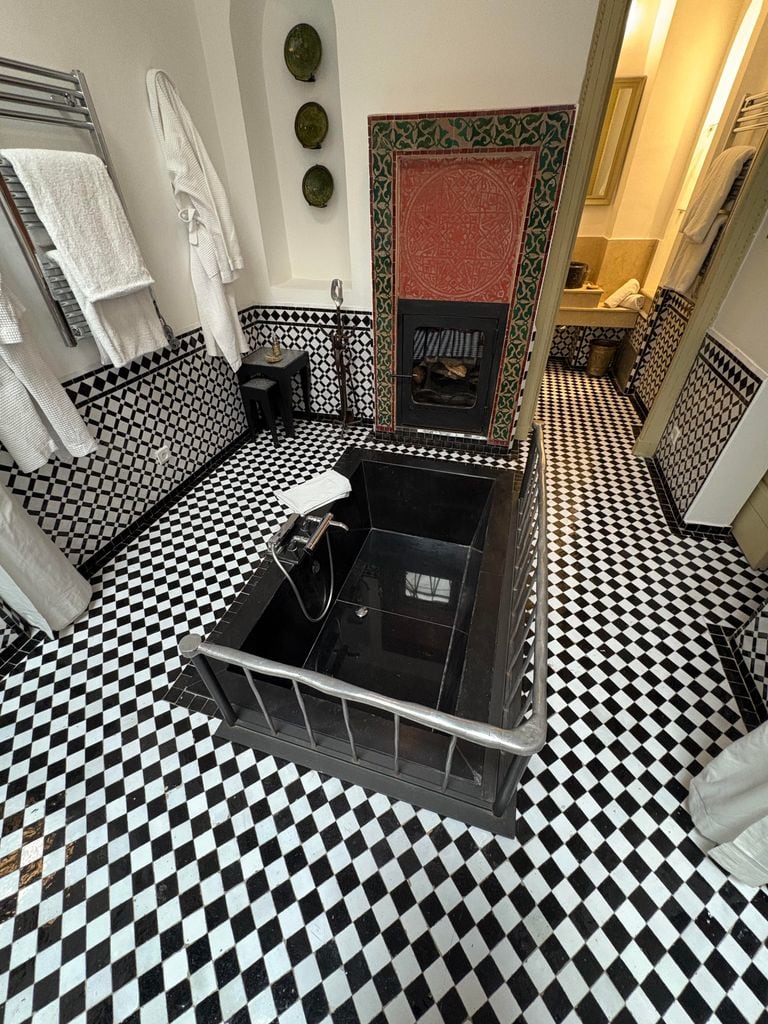 A bath in the middle of the floor