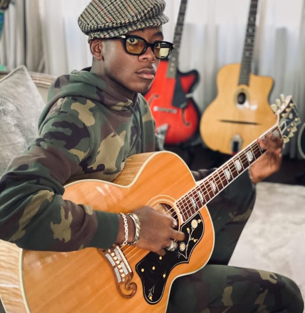 Madonna's son david playing guitar