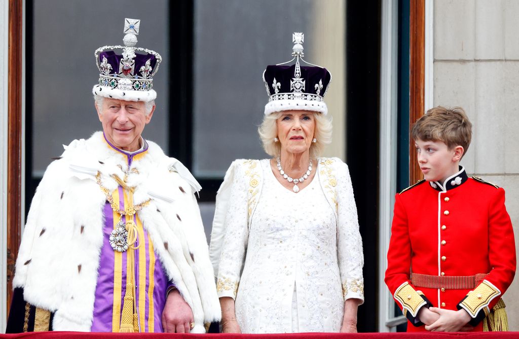 LONDON, UNITED KINGDOM - MAY 06: (EMBARGOED FOR PUBLICATION IN UK NEWSPAPERS UNTIL 24 HOURS AFTER CREATE DATE AND TIME) King Charles III, Queen Camilla and Page of Honour Freddy Parker Bowles watch an RAF flypast, following the Coronation of King Charles III & Queen Camilla at Westminster Abbey on May 6, 2023 in London, England. The Coronation of Charles III and his wife, Camilla, as King and Queen of the United Kingdom of Great Britain and Northern Ireland, and the other Commonwealth realms takes place at Westminster Abbey today. Charles acceded to the throne on 8 September 2022, upon the death of his mother, Elizabeth II. (Photo by Max Mumby/Indigo/Getty Images)