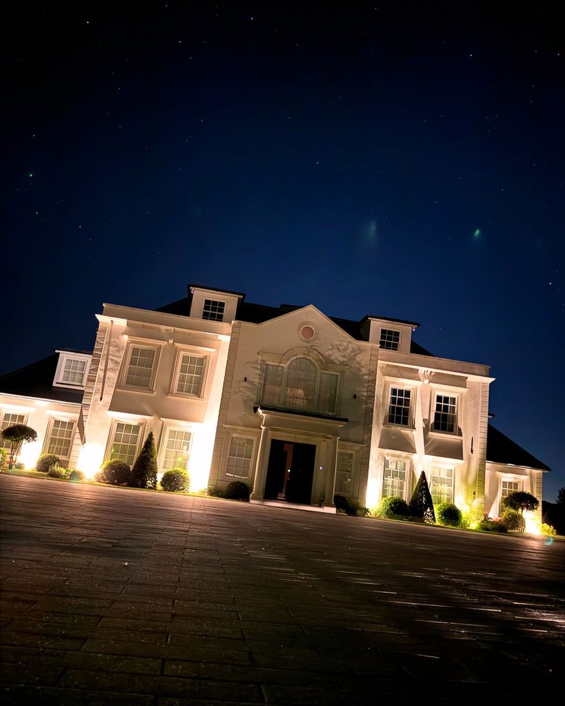 house lit up against the night sky