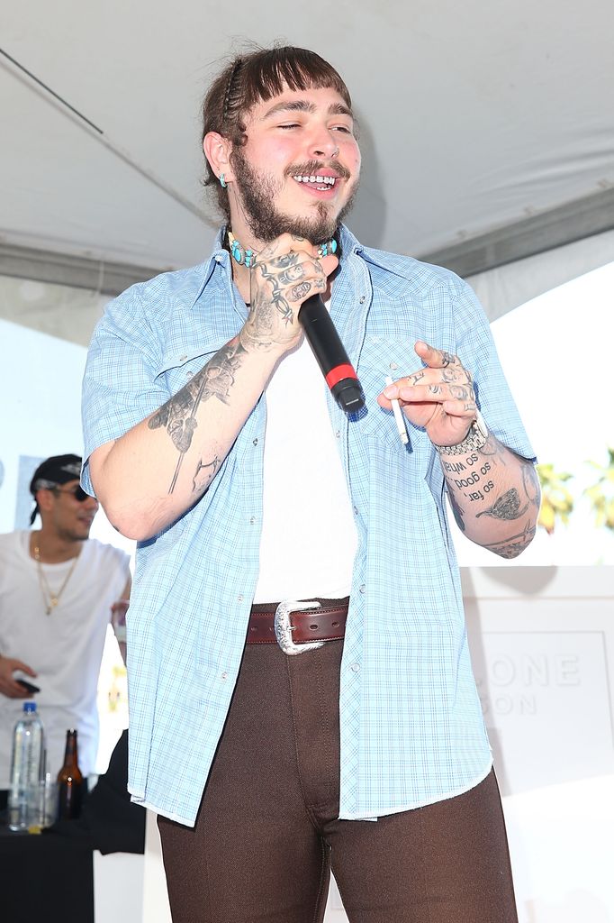 post malone in 2017 holding microphone