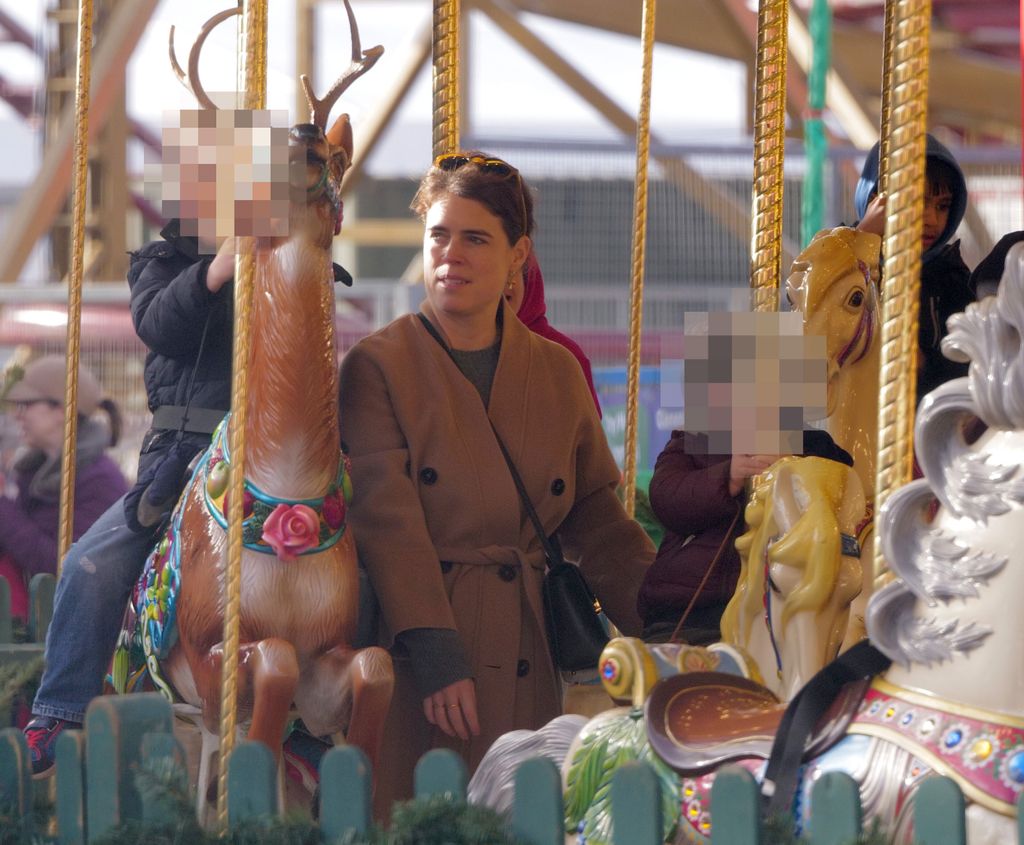 Princess Eugenie takes the family to Hyde parks Winter Wonderland for a fun day on the rides. Eugenie  pulls some funny faces as her friend films her on the childrenâs rides , then treats them to some hot dogs n pizza, followed off by some sweet treats .
Please take advice as to pixelating the childs face prior to publication.