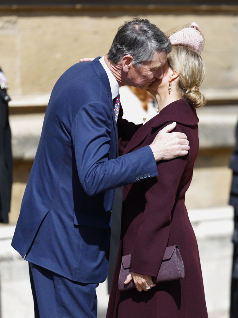 Sir Timothy Laurence kisses the Duchess of Edinburgh as they arrive at church