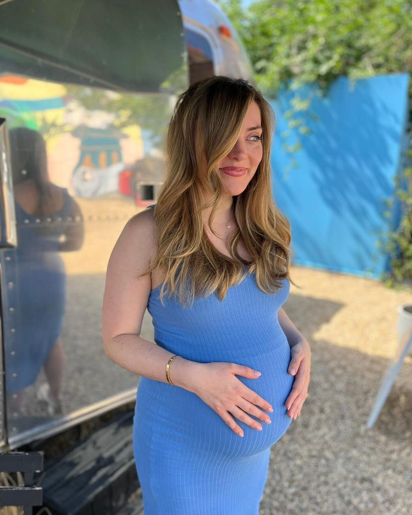 Lorraine kelly's daughter cradling bump