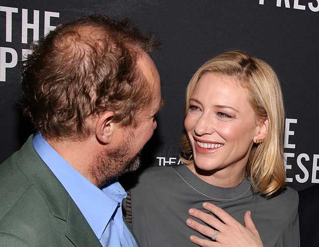 Cate smiling at her husband Andrew