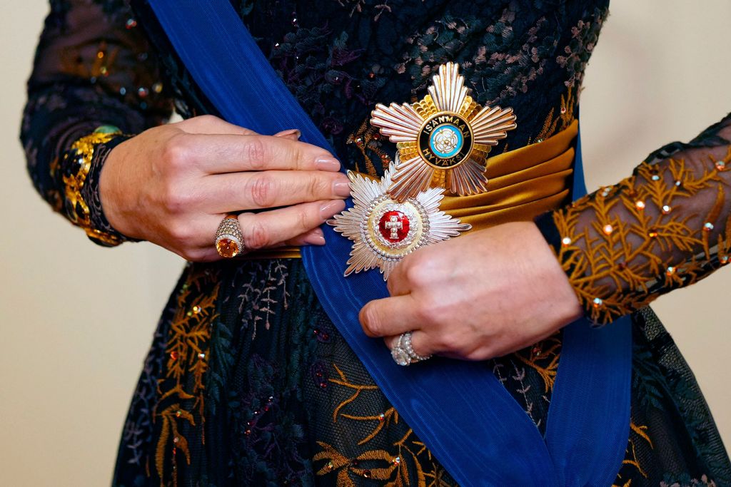 Denmark's Queen Mary wears her Grand Cross of the Order of the White Rose of Finland as she attends a gala dinner at the Presidential Palace in Helsinki, Finland