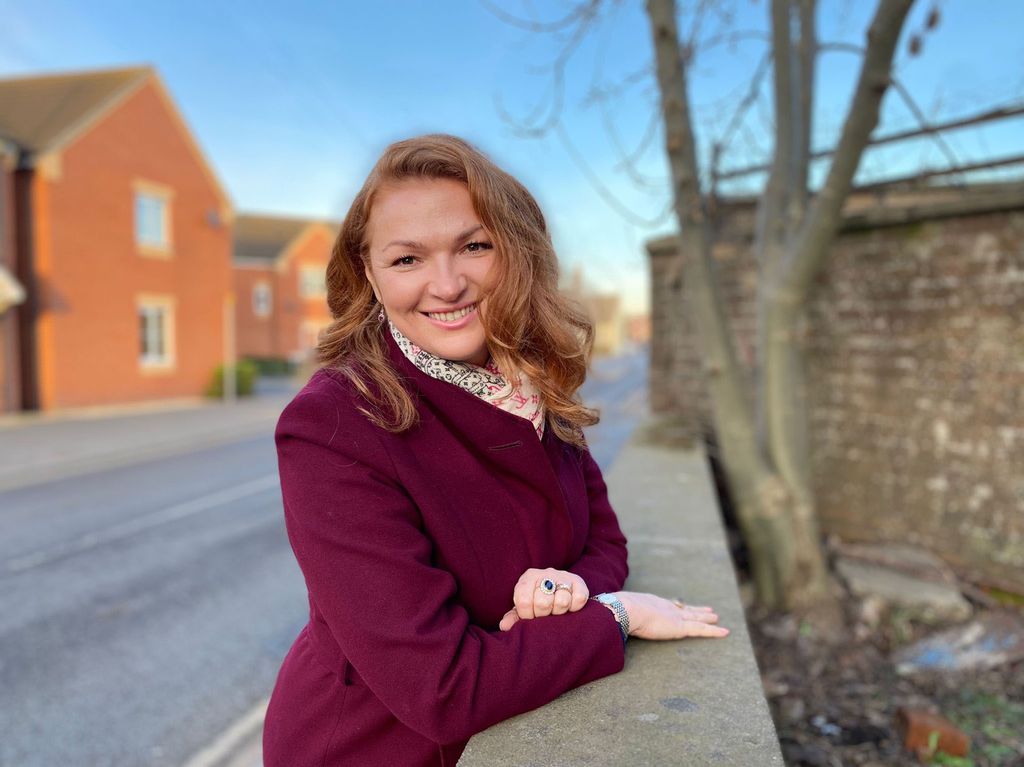 Irita Marriott in a crimson coat and scarf