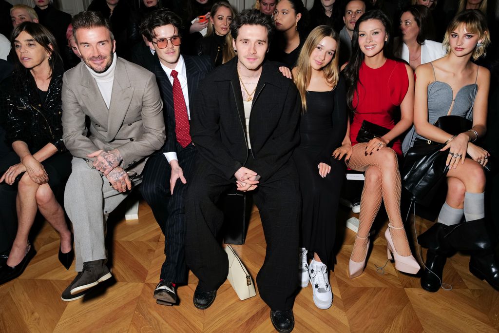 Davdi Beckham, Cruz Beckham, Brooklyn Beckham, Harper Beckham, Nicola Peltz-Beckham and Mia Regan sat at Paris Fashion Week