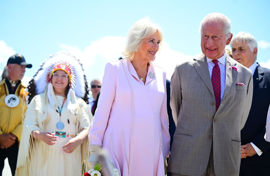 King Charles and Queen Camilla smiling at their Canada tour