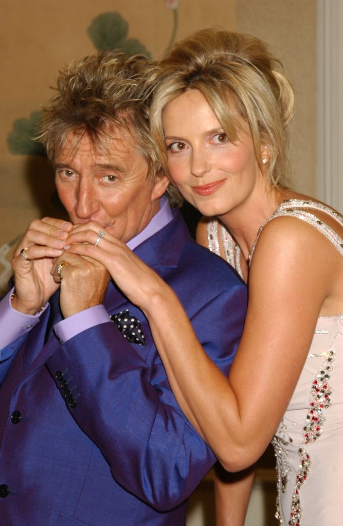 Rod Stewart kissing Penny Lancaster's hand in 2005