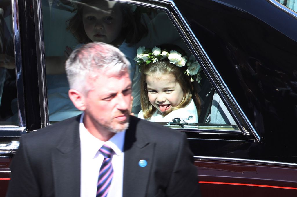 Princess Charlotte with her tongue out as she rode in a car 