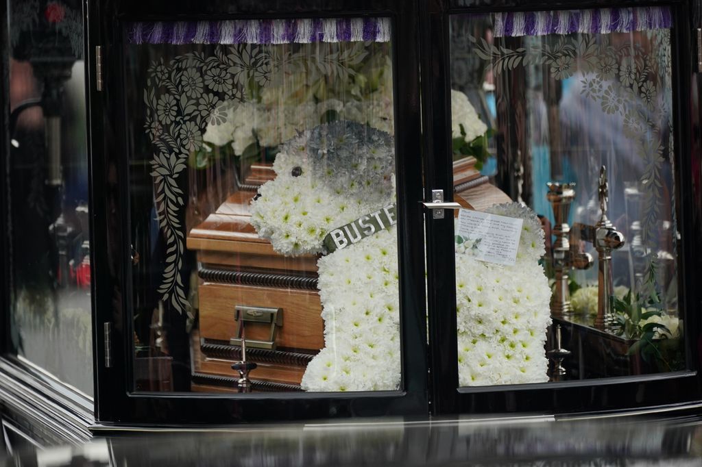 Floral tributes dedicated to Paul's beloved pet pooch Buster