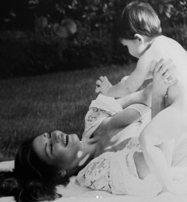 Catherine zeta jones plays with her son Dylan in old black and white photo