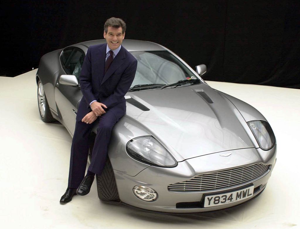 James Bond actor Pierce Brosnan with the Aston Martin Vanquish during a photocall for 'Bond 20', the working title for the latest film which starts production on the at Pinewood Studios in Iver, Bucks