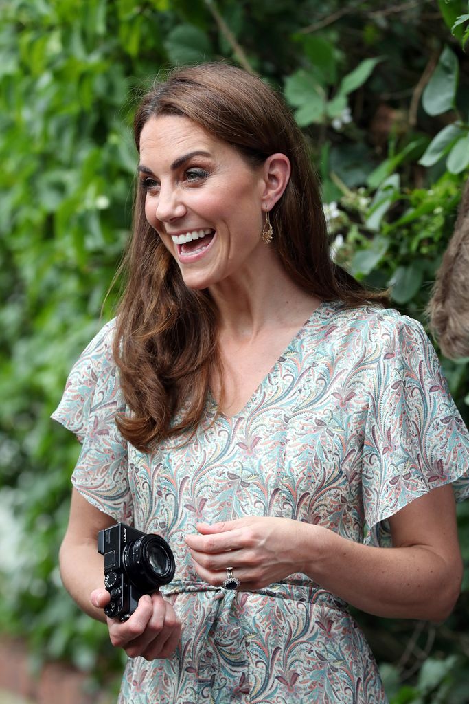 Princess Kate holding a camera 