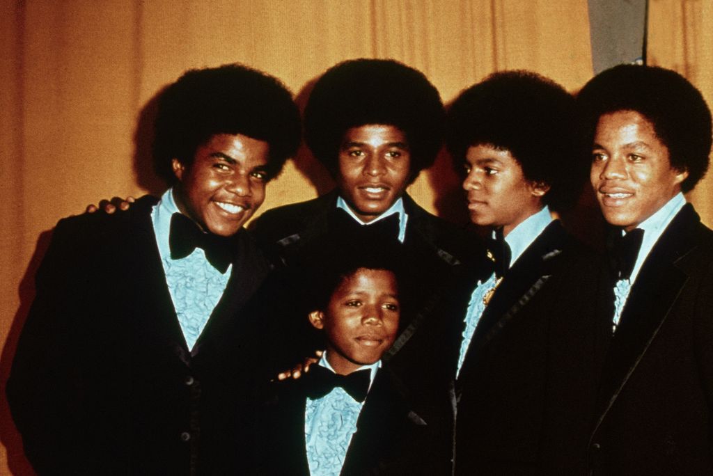 The Jackson 5 pose together in 1974. From left, Tito, Jackie, Marlon (in front), Michael, and Jermaine Jackson