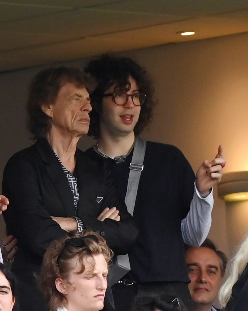 Mick Jagger and son Lucas watching a cricket match